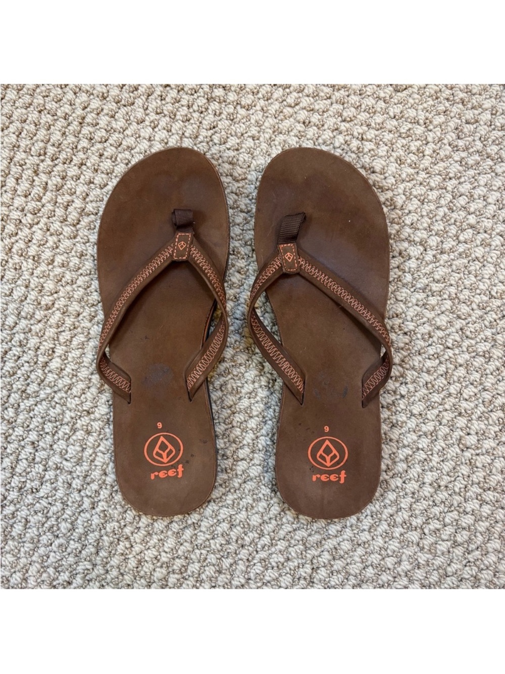 Reef Brown Leather-Style Thong Sandals with Orange Logo